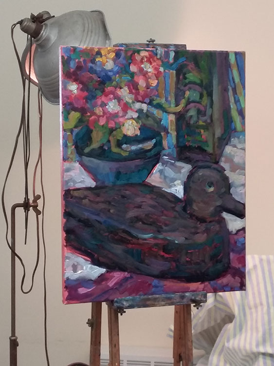 Heidi's demo painting of flowers, duck decoy, vase and fabric.