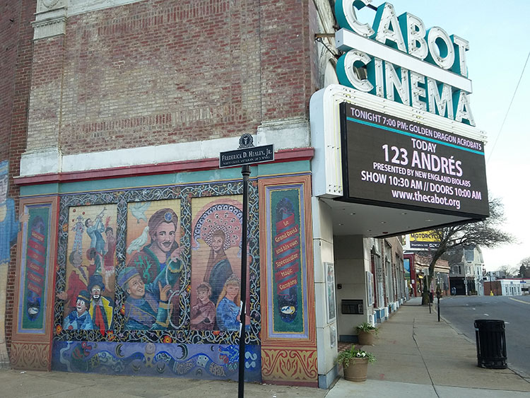 The mural on the side of The Cabot Theater in the Beverly Arts District features Le Grand David and His Own Spectacular Magic Company.