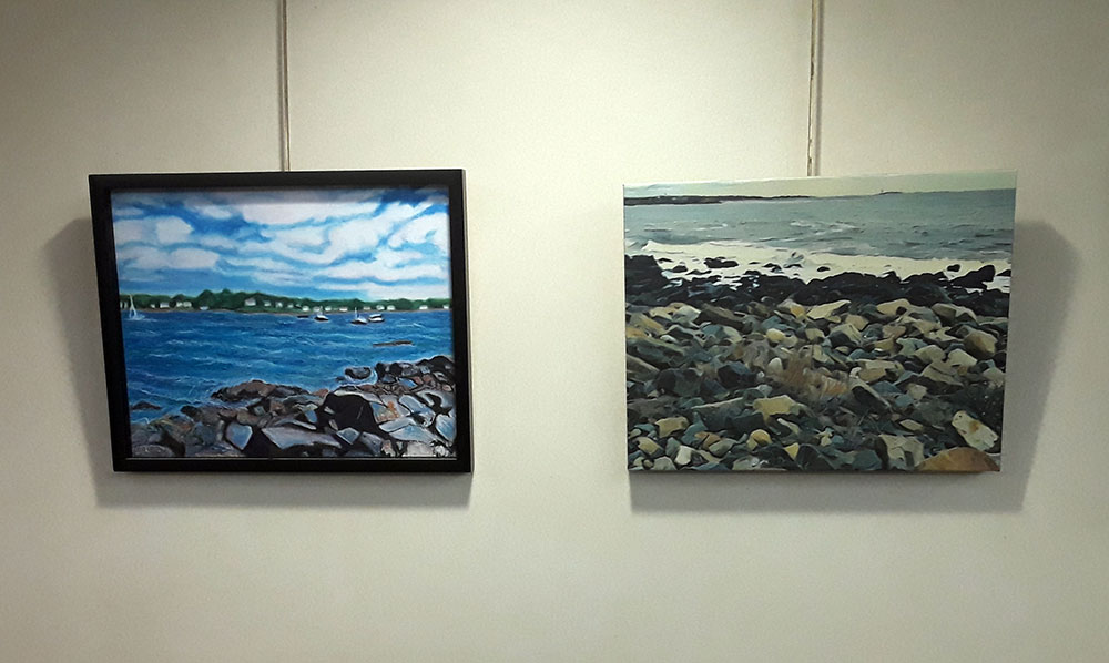 The oil pastel painting on the right is looking out from Winter Island, in Salem, MA. On the left is a digital art rendering of Bass Rocks, in Gloucester, MA. Both artworks are featured at the Beverly Public Library art show.